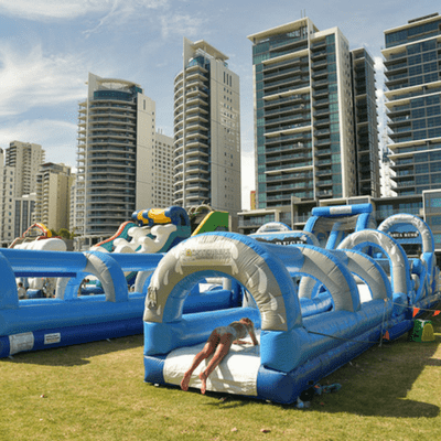 aqua rush inflatable hire with kids sliding